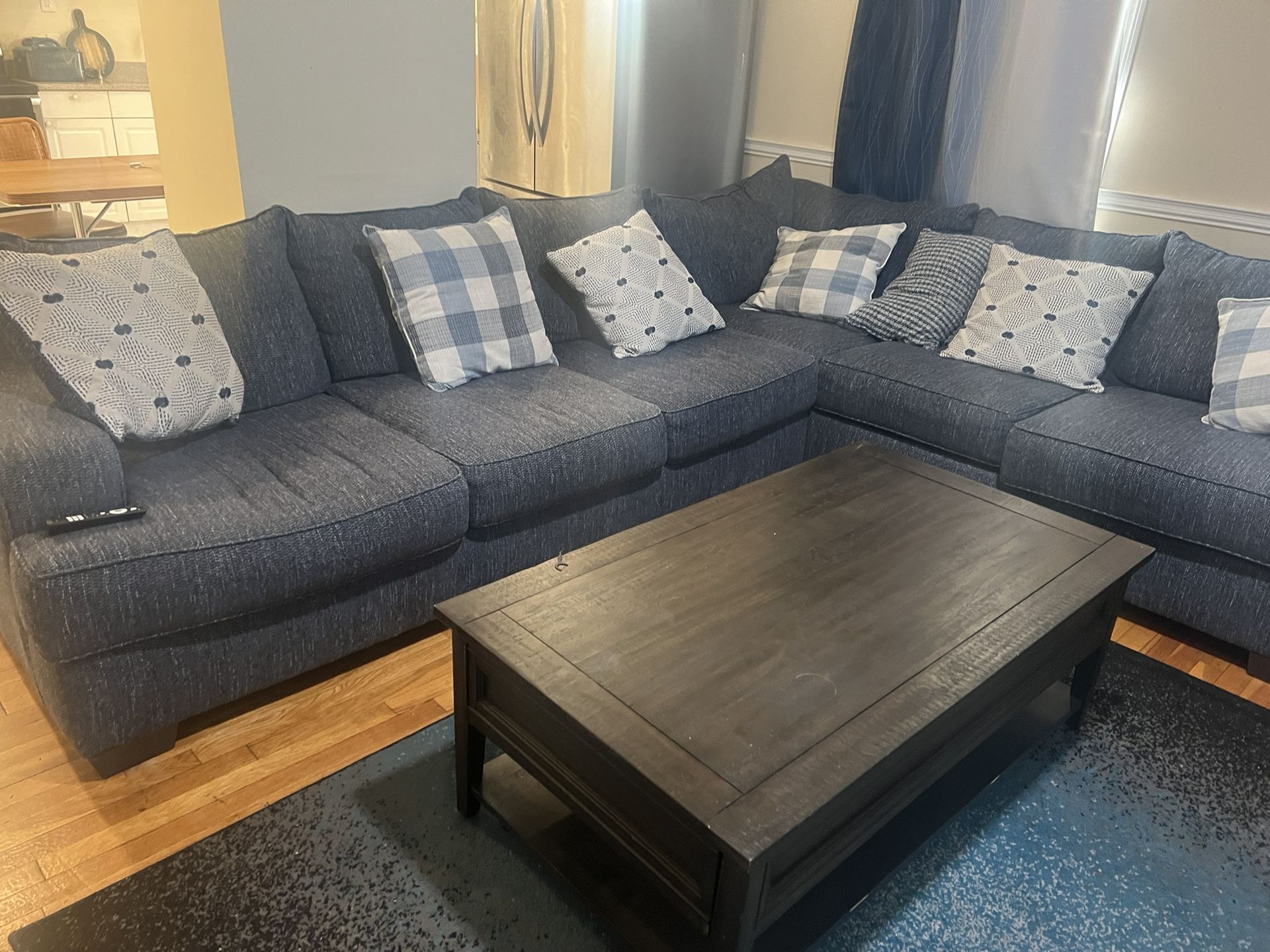 Used Couches ,75 Inches Of Television Set, and a Center Table