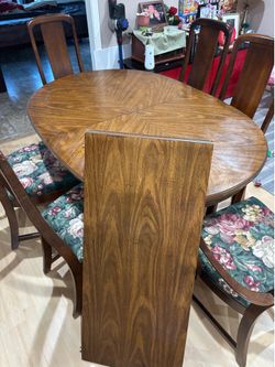 Oval dining table, 6 chairs, and leaf