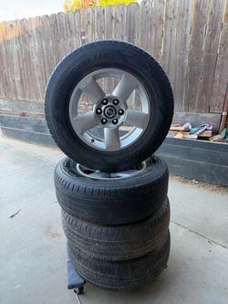 Factory Nissan Titan / Armada 18x8 6-Lug Rims and Tires - Set of 4