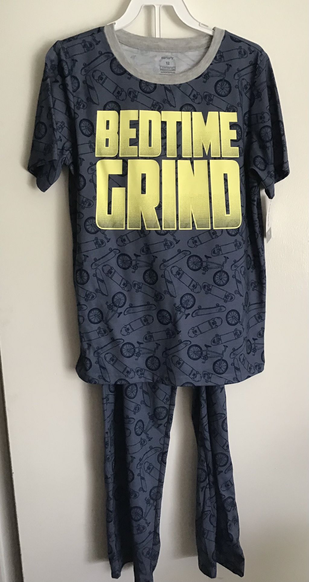 Carter’s 2 pc skateboard pajamas, size 12, New with tag