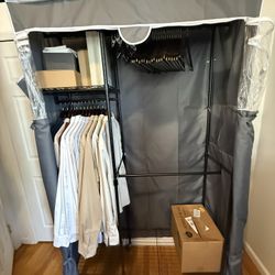 Rolling clothes rack with cover