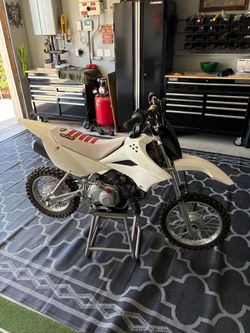 Kawasaki 110L title in hand