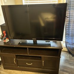 samsung tv with dresser/glasstop side table