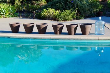 Medium-sized dark granite clay pots - $65 for a pair and $180 for all six