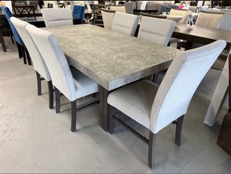 7-Piece Faux Marble Dining Set – $999.99 + Tax