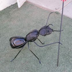 metal ant and stones for garden