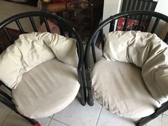 Two matching round wooden chairs