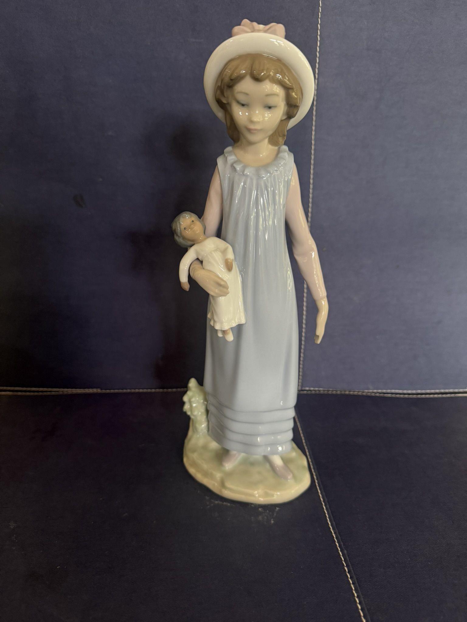 Lladro - Girl Holding Doll