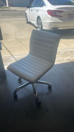White leather chair on wheels