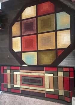 Two matching multi-color rugs