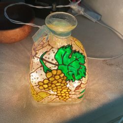 Lights In A Decorated Tequila Bottle