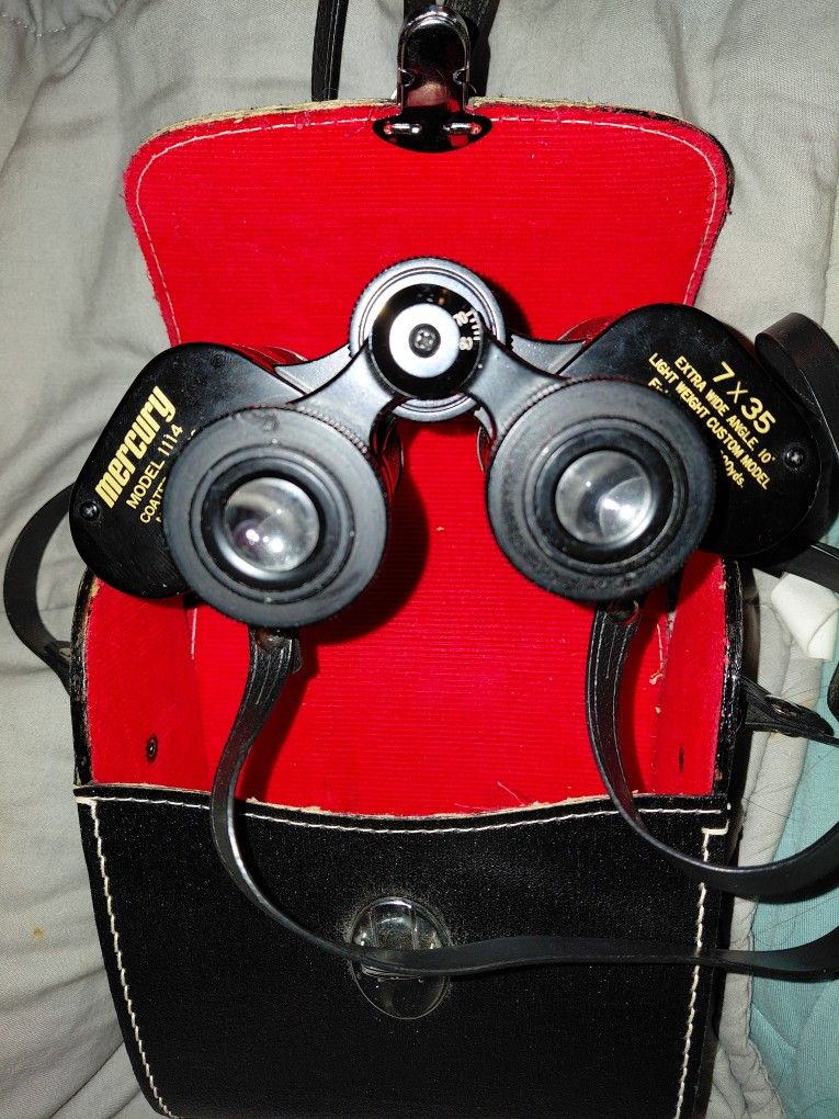  Mercury Model 1114 7x35 binoculars with a carrying case. 
