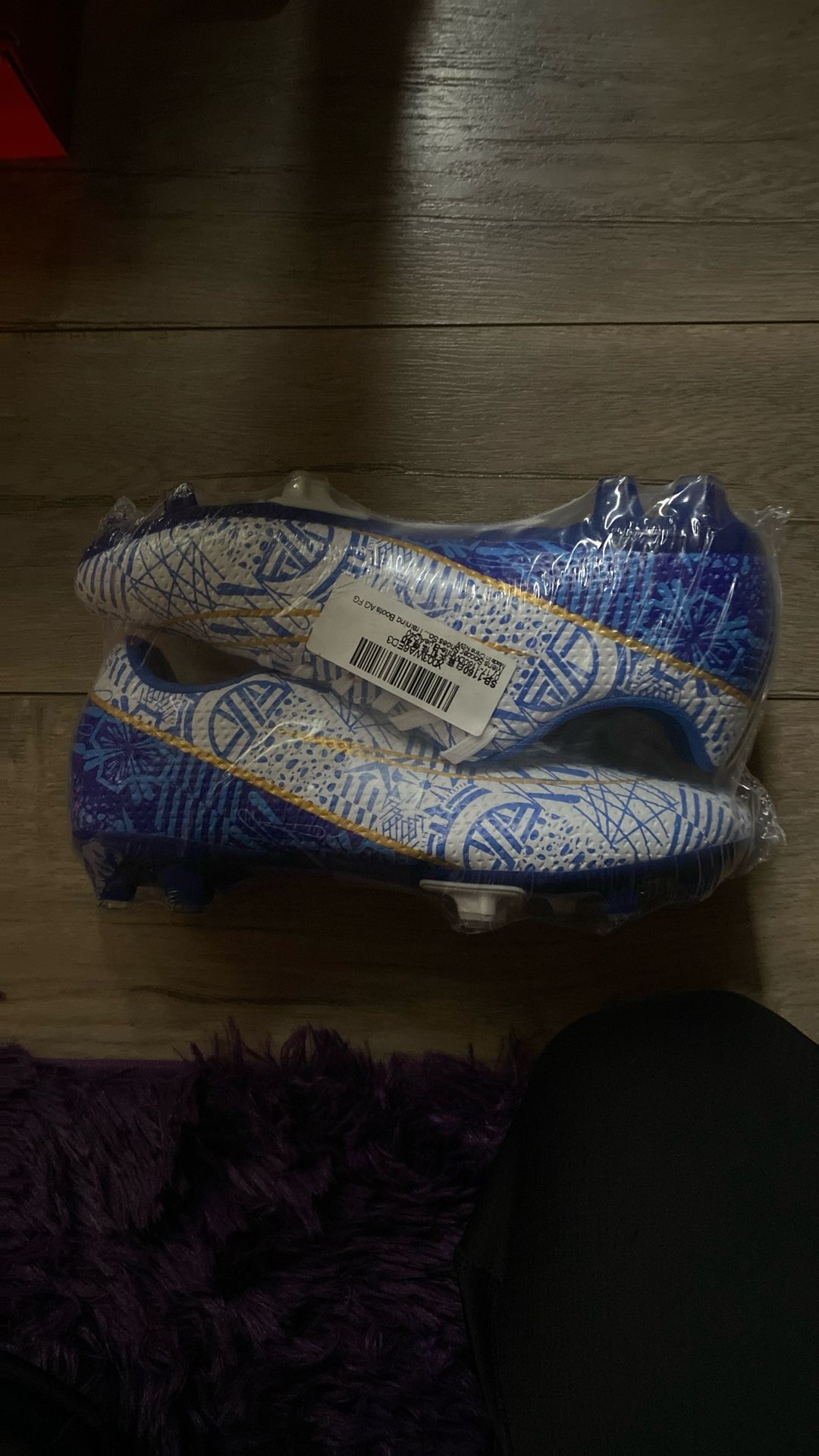 White, Blue, And Gold Soccer Cleats