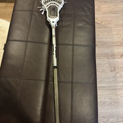 Lacrosse gear: stick, helmet, gloves, pads, cleats