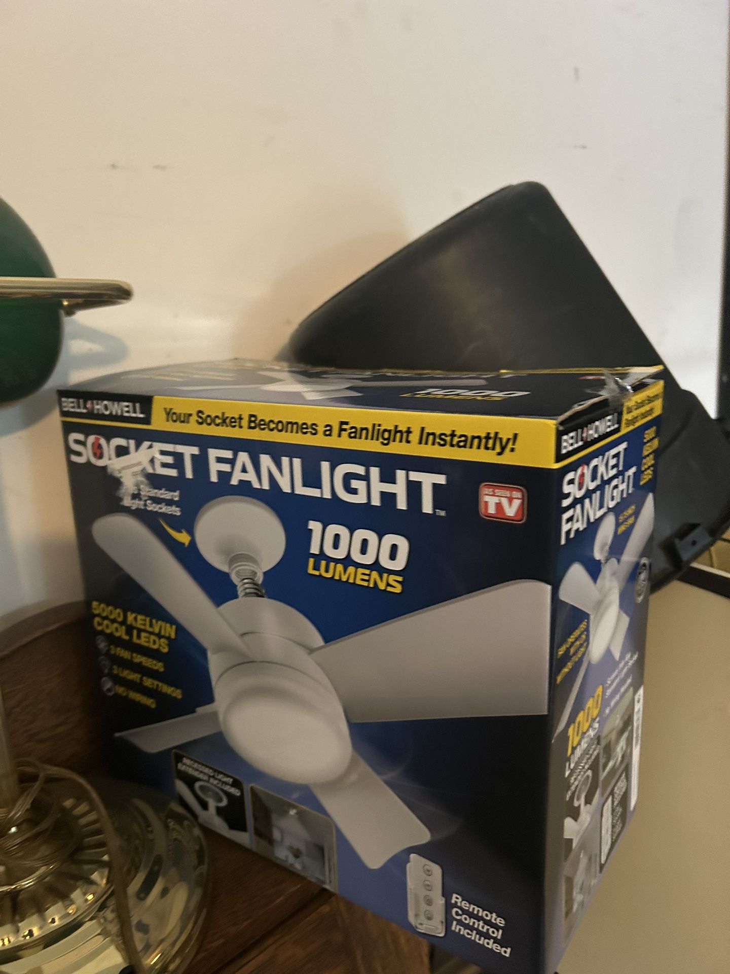 a Bell + Howell Socket Fanlight. It is a fan and light combination that screws into any standard light socket