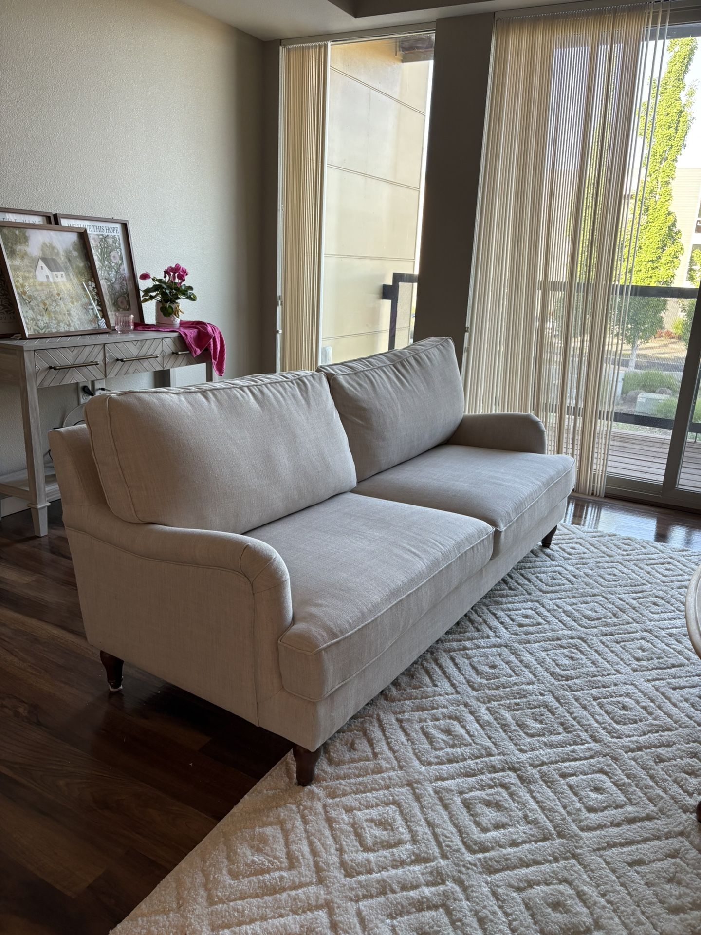 wood/upholstered cream colored sofa