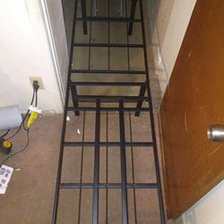 Foldable portable bed cut steel frame