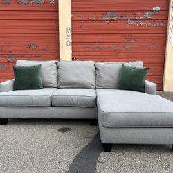 Ashley’s Gray Sectional Sofa Couch with right facing chaise