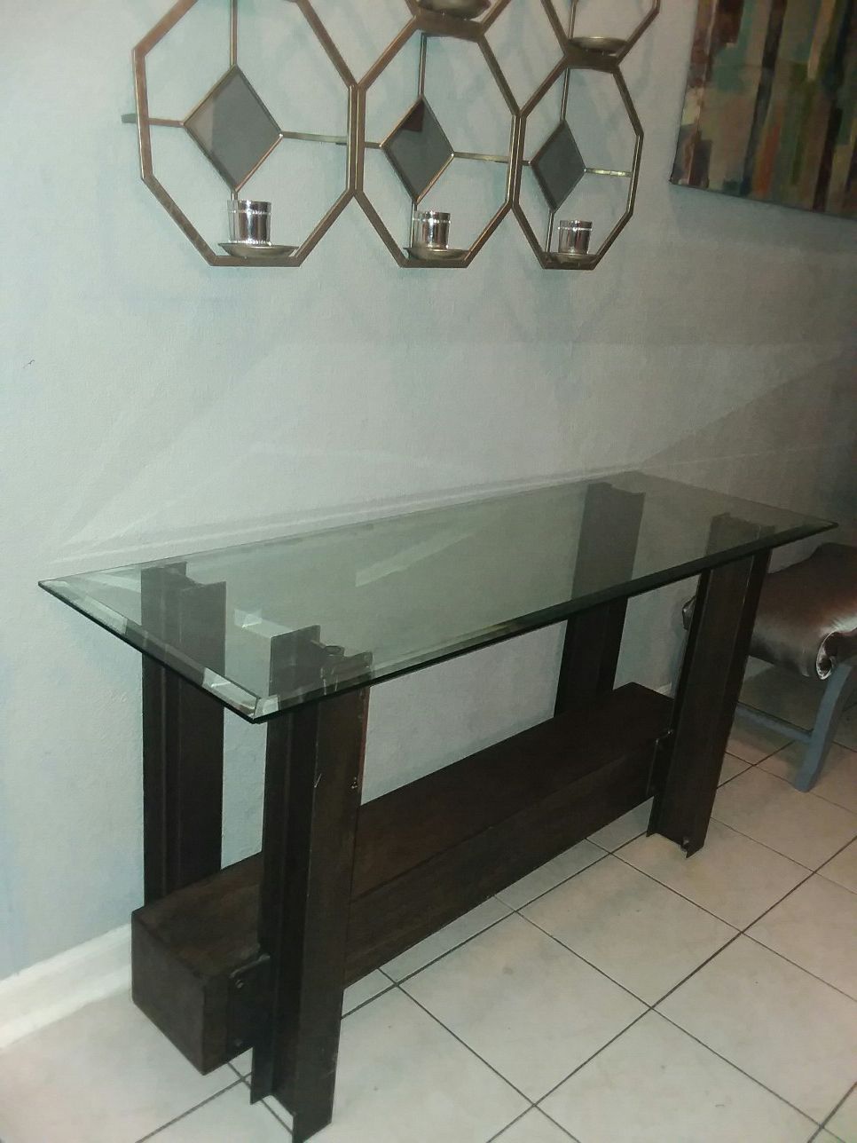 Heavy iron console table with thick beveled glass top