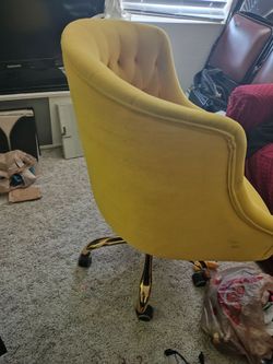 Yellow swivel chair