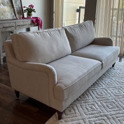 wood/upholstered cream colored sofa