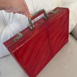 vintage red eel skin leather attaché briefcase features a distinctive diagonal panel design and dual combination locks