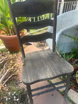 Two wooden ladder back chairs