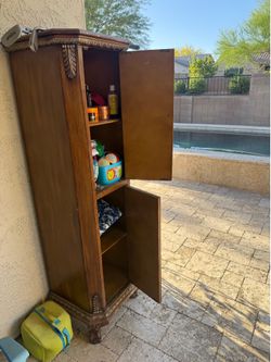 Tall wood storage cabinet