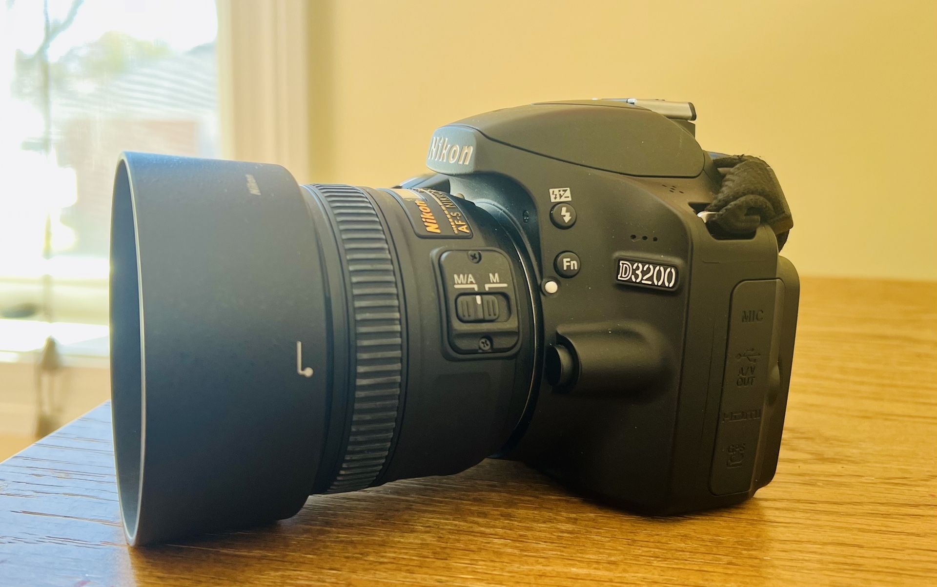 Nikon D3200 with accessories and prime lens
