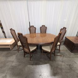 Ornate Brown Wood Dining Table With Six Cane Back Chairs