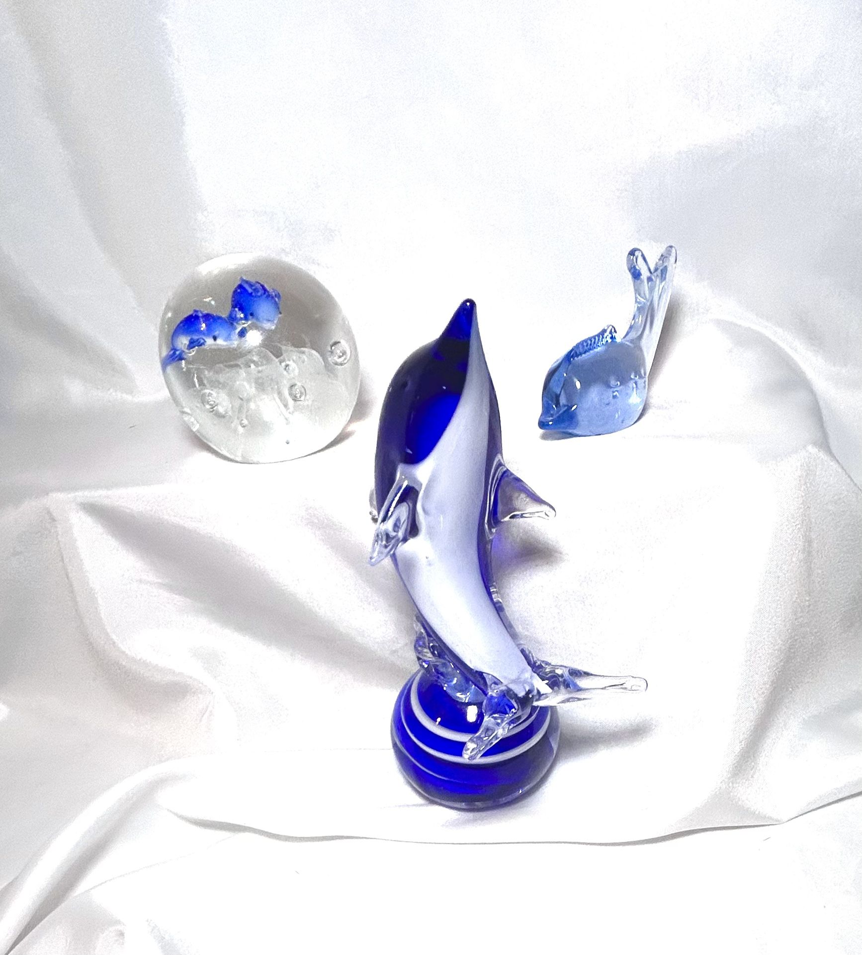 Glass dolphins. Cobalt blue and clear Dolphin figurines/paperweights. please see pics of slight chip