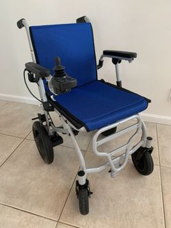 Brand new Rubicon DX04 electric wheelchair — never used and in excellent condition.