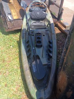 Pelican kayak with paddle and seat