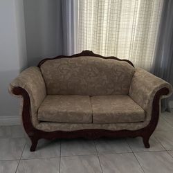 A Set Of A Loveseat And A Couch