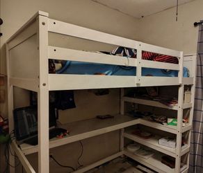 Bed with desk and shelves