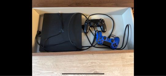 PlayStation 4 Slim Console with Two Controllers