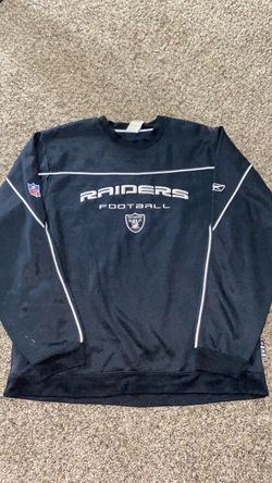 Raiders Sweater. I think the size is Large. Bleach stains on back but still rockable!