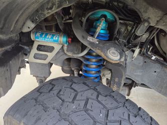 King 2.5 Adjustable coilovers with reservoir. These were on a 2013 Tundra 5in lift..