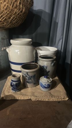 Set of six antique stone crocks