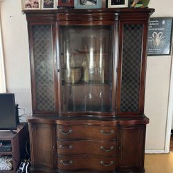 This is a mahogany federal-style china cabinet
