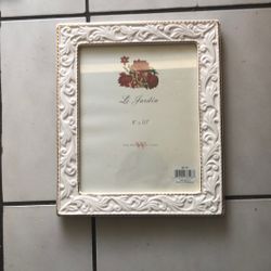 two framed, vintage-style map and ornate white picture frame