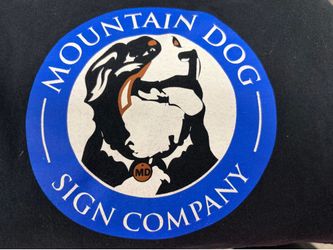 Black T-shirt, size medium with front emblem mountain dog sign company