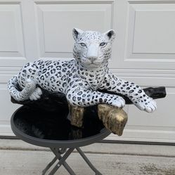 Snow Leopard On The Log Statue 