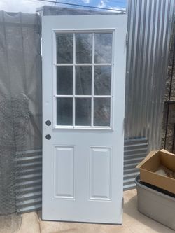32” x 80”  steel door with 9 lites left hand