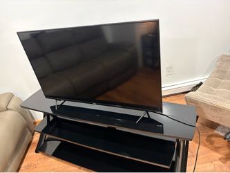 Onn. Roku Smart TV+ Modern Black TV Stand