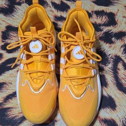 Adidas Boost low top men's athletic sneakers in solid yellow and white