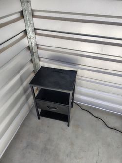 Small night stand w/ outlet