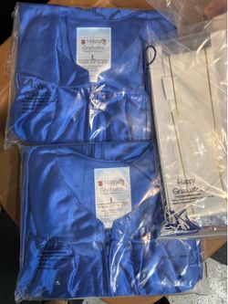 2 Child Graduation gowns. Brand new