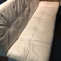 White Leather Futon Sofa.   Obo