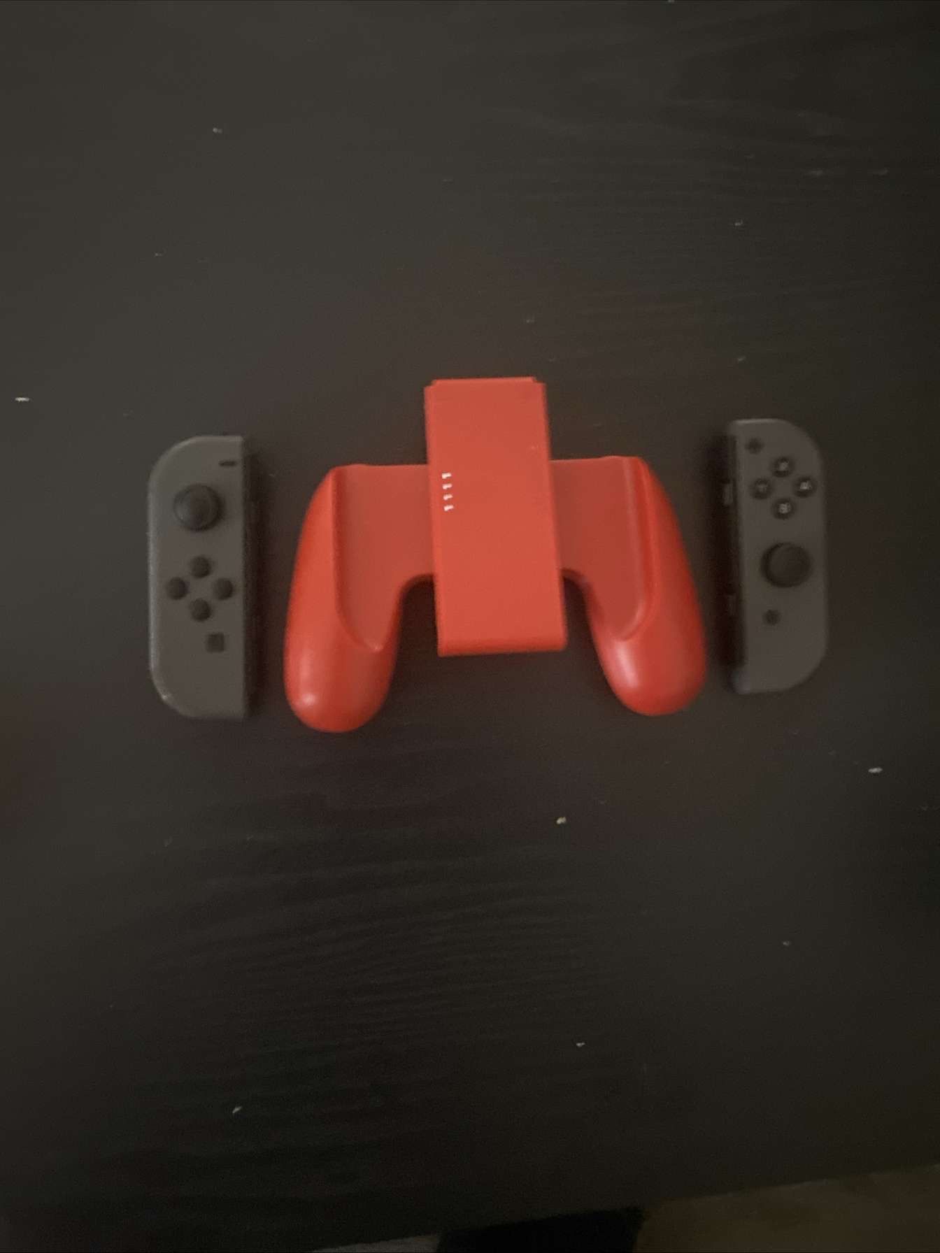 Grey Nintendo Switch Joycons With Red Controller Grip